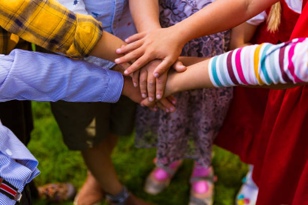 Kids standing in the circle and joining hands together